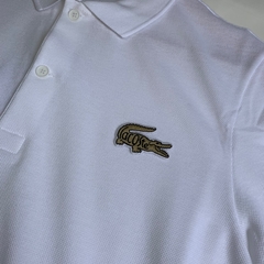 POLO LACOSTE CROC DOURADO