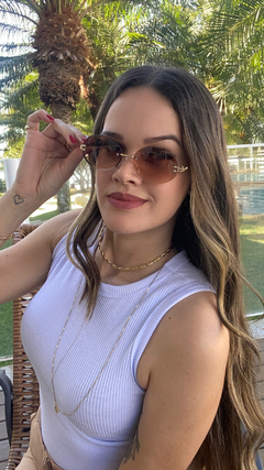 Solar Holli marrom - Óticas Flórida