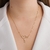 Colar Escrito Mãe com Zircônia Folheado a Ouro 18k.