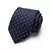 Gravata masculina de seda jacquard na cor azul marinho, adornada com poás brancos, apresentada em formato enrolado.