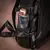 Mochila Executiva Masculina de Couro Legítimo para Notebook em couro preto, com compartimentos internos organizados, alça de segurança para notebook, detalhes em costura laranja e zíperes robustos e bolsos laterais nos dois lados bolsos com profundidade.