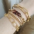 PULSEIRA DOURADA COM MARROM - comprar online