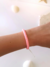 Pulsera Cati - chicle suave, hilo blanco