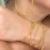 Imagem do Pulseira Corda com 10 Voltas no Braço Fecho Imado Banhado a Ouro 18k