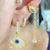 Piercing Fake Olho Grego com Cilios Cravejado em Zirconias