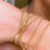 Pulseira Corda com 10 Voltas no Braço Fecho Imado Banhado a Ouro 18k - loja online