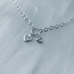Pulseira pingente coração e coração com zircônia - comprar online