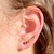 Brinco Ear Cuff com Zircônias Coloridas Semijoia Ouro na internet