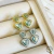 Brinco Dois Corações de Zircônia Aquamarine Semijoia Ródio Branco na internet