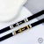 Pulseira Masculina Silicone Preta Detalhe de Cruz no Aço Inox Dourado - comprar online