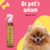 Frasco do Fluído Texturizador Volume Supremo Âmbar Cereja E Avelã Dolce Pet com um cachorro Pomeranian sorridente ao fundo.