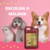 Frasco de shampoo suave Esmeralda Cereja e Avelã de 5L com um cachorro corgi, um poodle e um gato em fundo rosa.