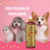 Frasco de shampoo neutralizador de odores Turmalina Cereja e Avelã da Dolce Pet ao lado de um cachorro, um gato e um cão da raça corgi em fundo rosa.