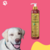 Shampoo Suave Esmeralda Cereja e Avelã da Dolce Pet, com cachorro sorridente ao fundo.