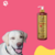 Frasco de shampoo neutralizador de odores Turmalina Cereja e Avelã da Dolce Pet, com um cachorro sorridente ao lado em fundo rosa.