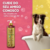 Frasco de shampoo Suave Esmeralda Cereja e Avelã da Dolce Pet com um cão em uma banheira
