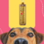 Frasco de condicionador Rubi Liso Absoluto Cereja e Avelã da Dolce Pet, com um cachorro focando na câmera ao fundo.