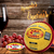 Queijo Reino Cuia Campanella com uvas e taça de vinho ao fundo, em uma mesa rústica.