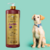 Frasco de Shampoo Clareador Tonalizante Ametista Cereja e Avelã de 1 litro ao lado de um cachorro de pelo claro.