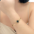 Bracelete Trevo Central com Zircônias em Aço Banhado em Ouro 18k - comprar online
