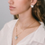 Conjunto Brinco e Colar Triangular Perolado Banhado em Ouro 18k - comprar online