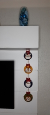 Enfeite de porta mini guirlandas com personagens do Natal
