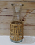 Botella vidrio con Mimbre