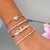 Pulseira de fita com letras cravejadas em zircônias na internet