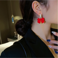 Aretes moño rojo , poste de plata .925 en internet