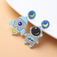 Astronauta y cohete acrílico aretes