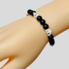 Pulsera calaveras y ónix para dama