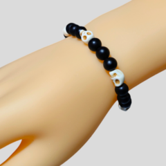 Pulsera calaveras y ónix para dama