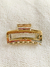 Broche dorado