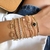 Pulseira cristais e medalhinhas banhada a ouro 18k - comprar online
