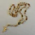 Terço Dourado Degradê - Via Sacra- SP0617 - comprar online
