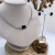 CONJUNTO RIVIERA E BRINCO PEDRAS RODIO BRANCO