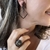 ANEL OVAL CRISTAL QUARTZO FUME RÓDIO NEGRO na internet