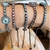 PULSEIRA SHAMBALA OLHO GREGO PRATA925 RODINADA - loja online