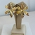 BRINCO FLOR TRABALHADA SEMIJOIA