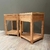 Mesa de luz de madera con dos cajones y estante inferior, ideal para decoración de interiores.