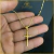 Cordão Modelo Cadiado Alongado Banhado a Ouro 18k com Pingente de Cruz