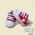Dois tênis infantis rosa para meninas, estilo All Star, com detalhes em branco.