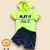 Conjunto infantil para menino com camiseta verde neon e bermuda jeans fake.