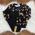 Conjunto infantil masculino de moletom pelúciado com estampa de dinossauro e detalhes em preto e amarelo
