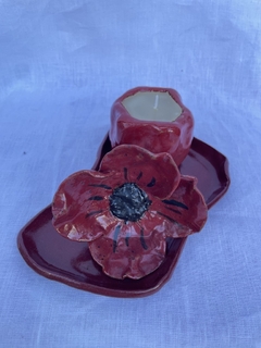 Porta vela com vela aromática, feita a mão em cerâmica. na internet