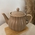 Bule de Chá de Porcelana Pétala Areia Matt 950ml - comprar online