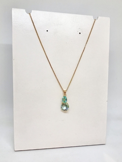 Colar dourado com pingente gota cristal azul claro e cristal redondo azul claro - comprar online