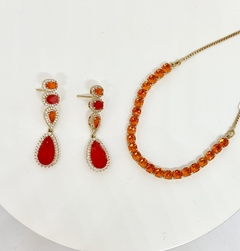 Pulseira dourada riviera laranja com fecho gravata na internet