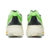 Par de tênis esportivos Adidas Adizero Prime X na cor verde linho com detalhes pretos e sola branca, vistos de trás.