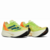 Tênis de corrida Adidas Adizero Prime X nas cores verde-limão e laranja fluorescente com solado branco e detalhes em preto